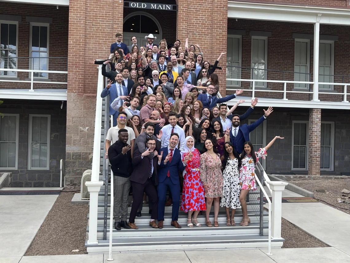 MedCats Class of 2024 pose on the steps of Old Main